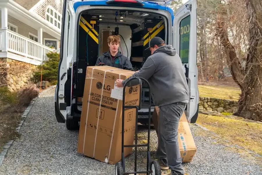 Cape Heating AC & Electric technicians installing AC in residential home on Cape Cod, MA.