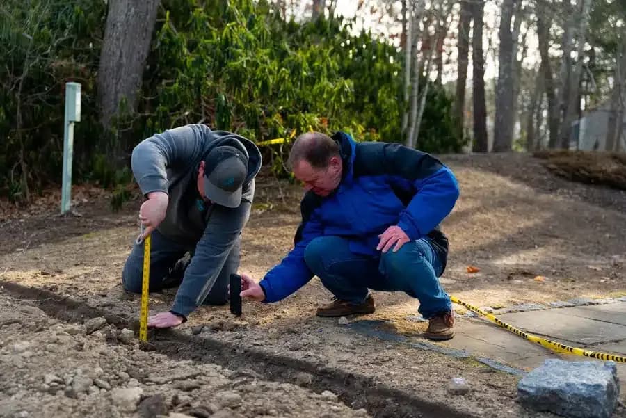 Cape Heating AC & Electric technicians working on electrical line on Cape Cod, MA.