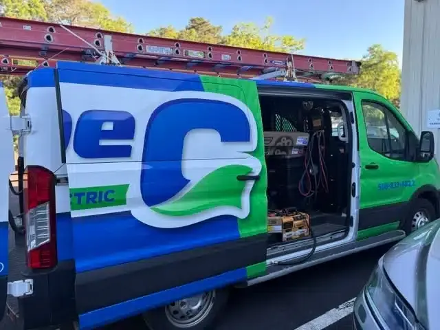 Cape Heating AC & Electric service van with open cargo doors, ladder rack, and tools ready for a Cape Cod, MA job
