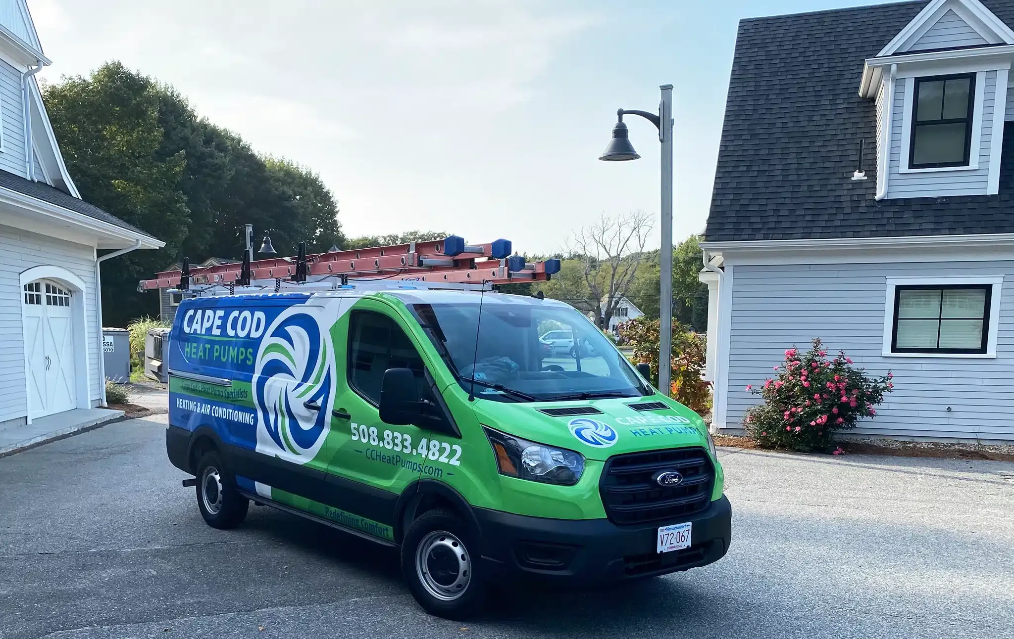 Cape Heating AC & Electric truck in front of residential home on Cape Cod, MA.
