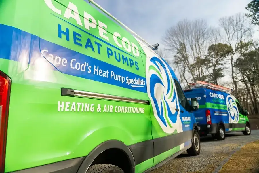 Cape Heating AC & Electric Vans outside of residential home on Cape Cod, MA.