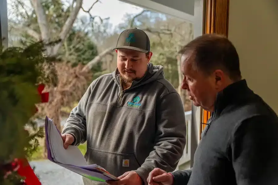 Technician helping homeowner on Cape Cod, MA.