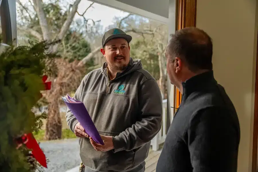Technician helping homeowner on Cape Cod, MA.