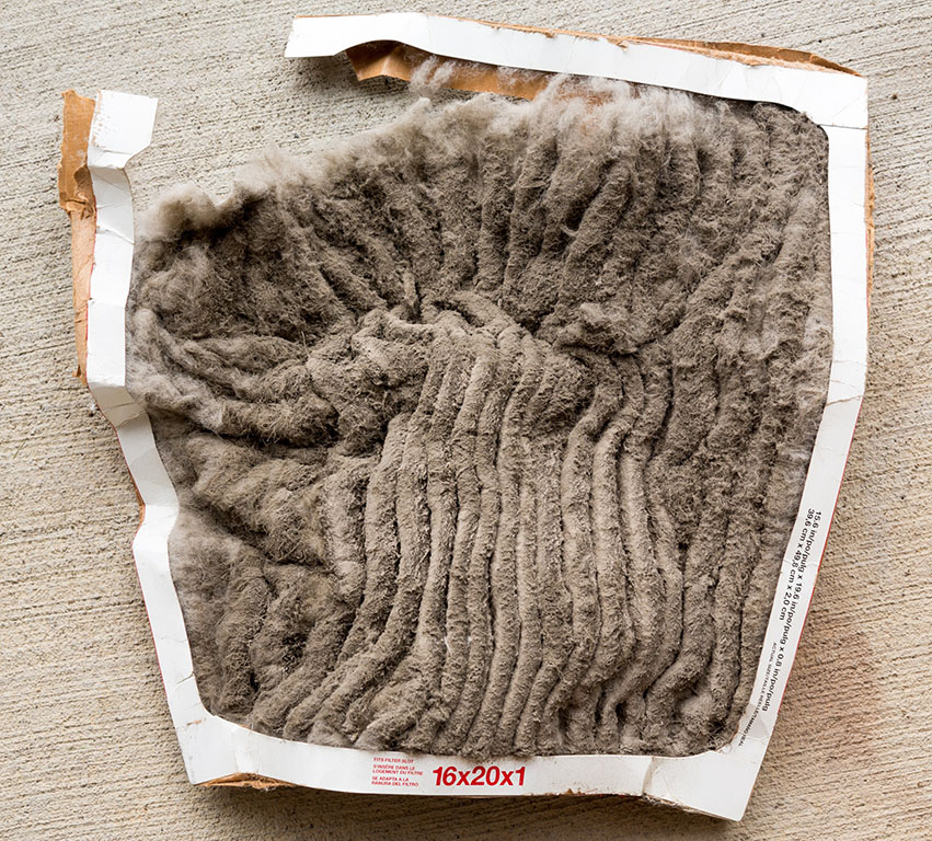 A dirty air filter on Cape Cod. This air filter has not been changed recently enough and will contribute to poor indoor air quality.