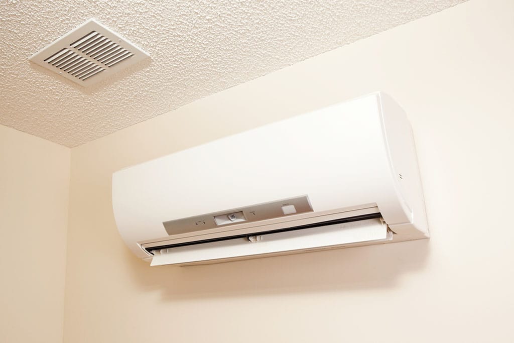 A wall-mount mini-split heating and air conditioning unit installed in a Cape Cod house.